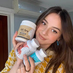 Woman holding the Kallistia perfect skin kit, Anti-Aging collagen complex, Hyperpigmentation Cleanse Capsules, Acne Cleanse Capsules